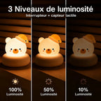 Veilleuse LED ours Bouba avec trois niveaux de luminosité réglables, pour adapter l'intensité selon le moment de la soirée